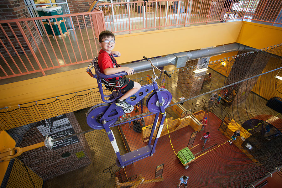 A child interacts with an exhibit at the Discovery Center of Springfield.
