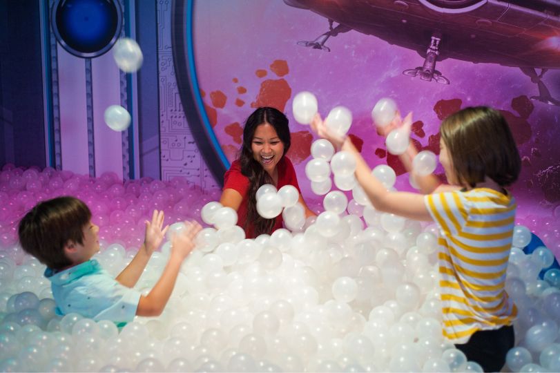A promotional photo of a family enjoying Beyond the Lens! Branson.