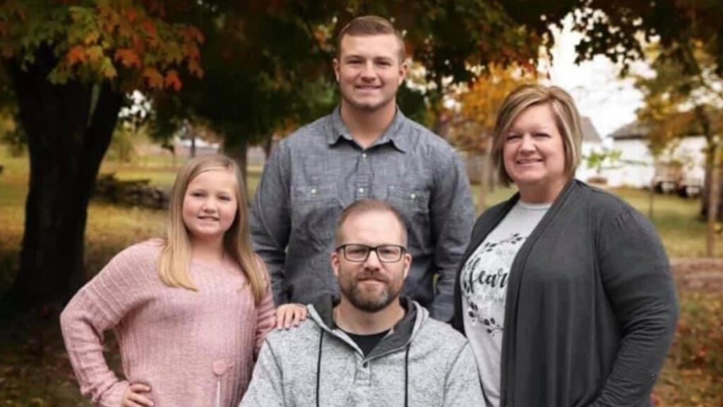 Retired Springfield police officer Mark Priebe (center) poses for a photo with his family.
