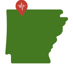 A green outline in the state of Arkansas with a red pin in the location of Harrison.